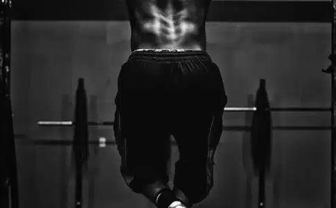 grayscale photo of man working out